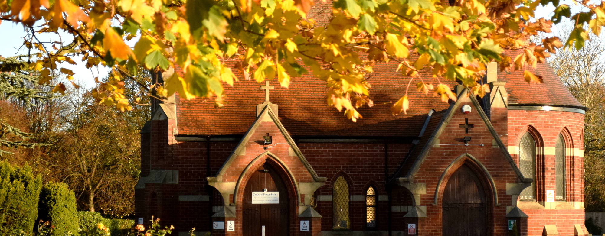 The Chapel of Remembrance surrounded by autumn leaves